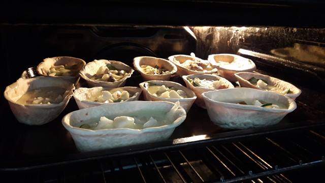quiches baking in the oven