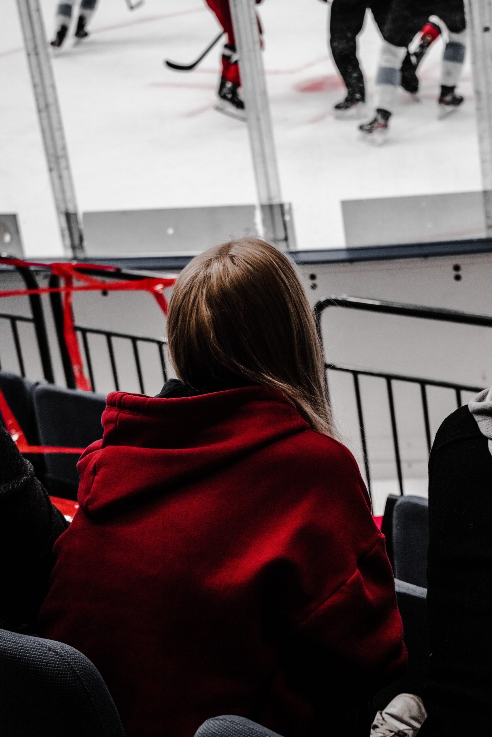 woman watching ice hockey