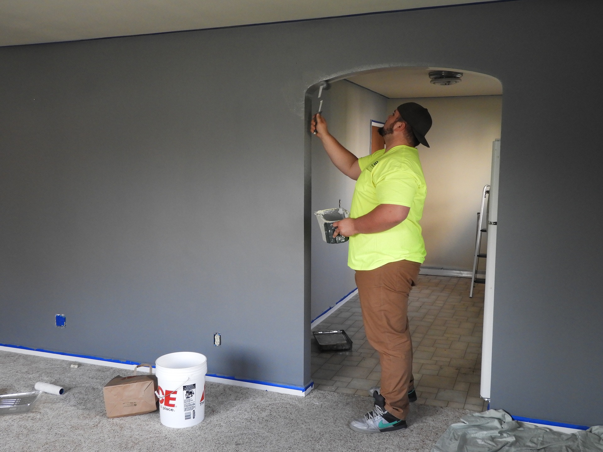 man decorating an archway