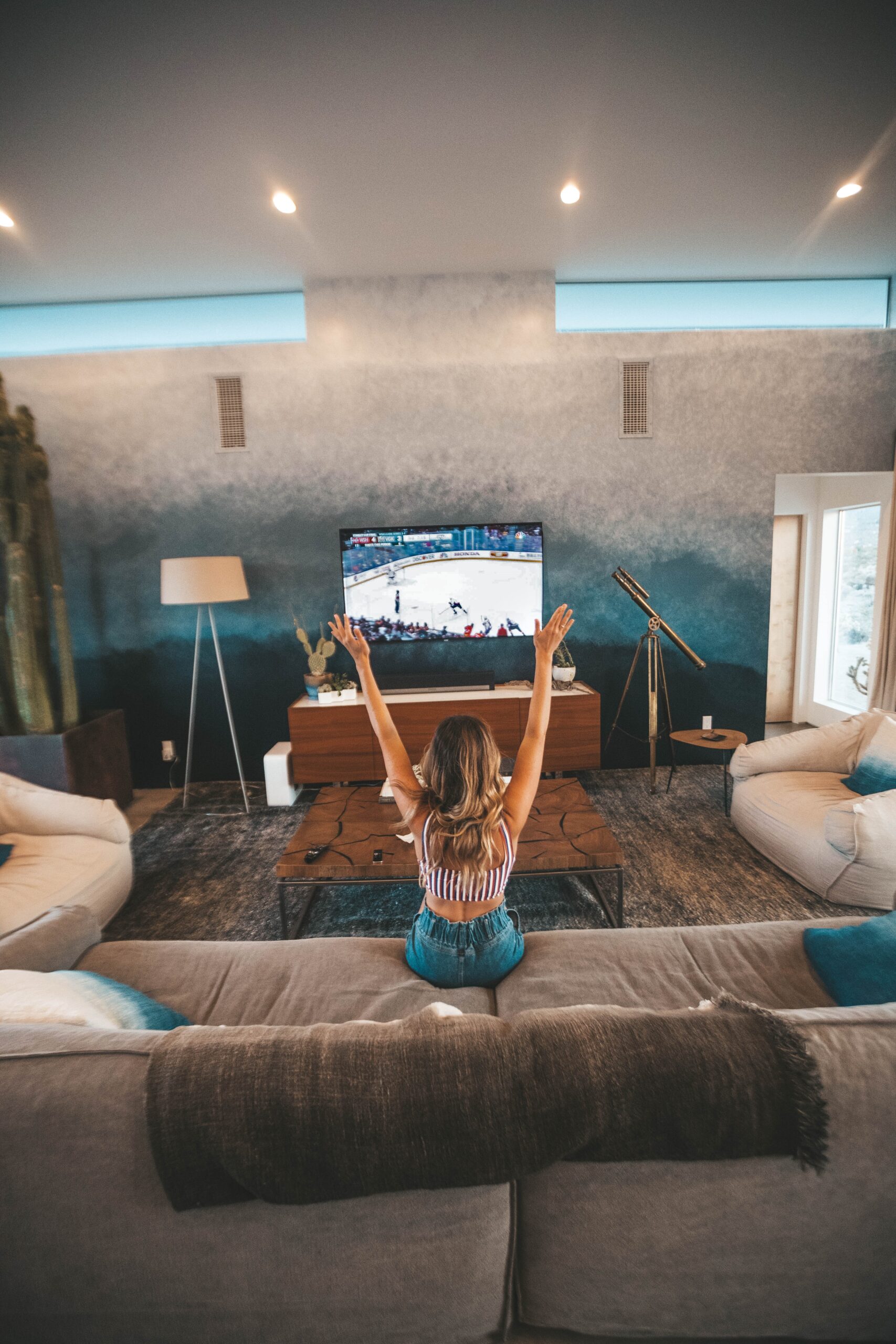woman watching sport on TV